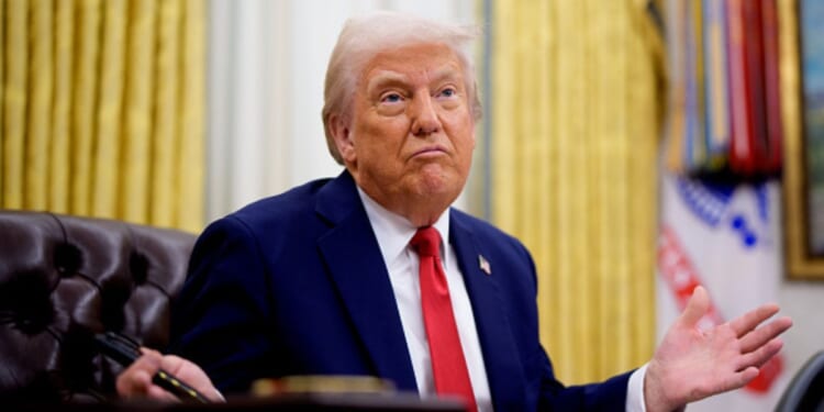 President Trump shrugs in the Oval Office at the Resolute Desk on March 31, 2025.