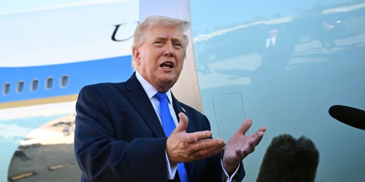 President Donald Trump speaks to reporters before boarding Air Force One at Palm Beach International Airport on March 23, 2026 in West Palm Beach, Florida.