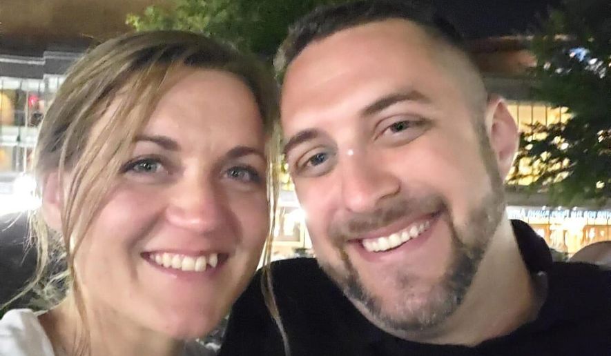 This undated photo provided by Joey Amor shows Nicole Amor, left, and Joey Amor smiling for a photo. (Joey Amor via AP)