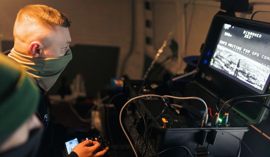 Soldiers of the 127th Separate Territorial Brigade operate a drone that searches for Russian attack drones at the front line in the Kharkiv region Saturday, March 14, 2026. (AP Photo/Nikoletta Stoyanova)