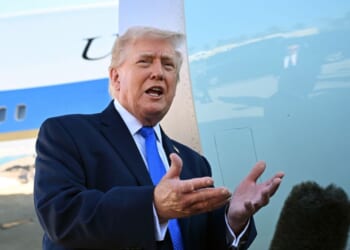 President Donald Trump speaks to reporters before boarding Air Force One at Palm Beach International Airport on March 23, 2026, in West Palm Beach, Florida.