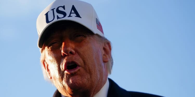 President Donald Trump speaks to the media before hopping on board Air Force One on March 13, 2026 at Joint Base Andrews, Maryland.
