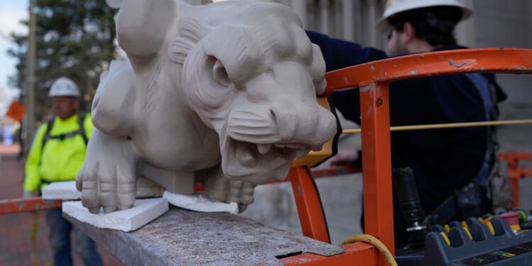 Final gargoyle returned to its perch atop rehabbed Kentucky cathedral modeled after Notre Dame