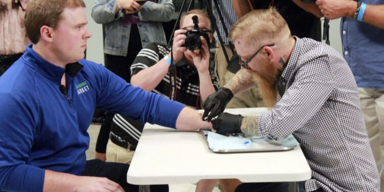 Are companies microchipping their workers? Yes — and states are cracking down