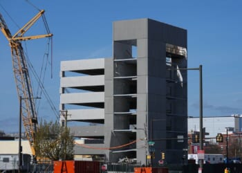 1 killed and 2 missing after partial roof collapse at parking garage being built in Philadelphia