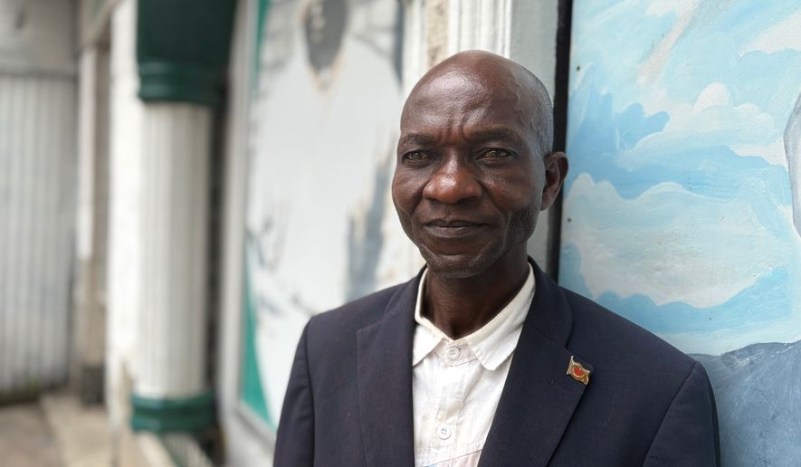 Toussaint Mungwala, a Kimbanguist pastor from the province of Kuilu, poses at a reception center for the faithful in Kinshasa, Democratic Republic of the Congo, Sunday, April 5, 2026. (AP Photo/Rodney Muhumuza)