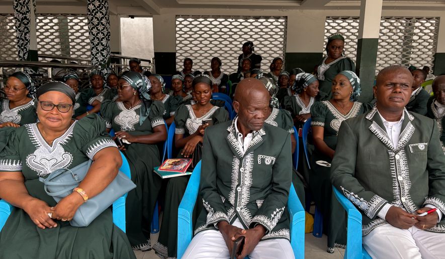 Kimbanguist Church members attend Easter Sunday service at a reception center for the faithful in Kinshasa, Democratic Republic of the Congo, Sunday, April 5, 2026. (AP Photo/Rodney Muhumuza)