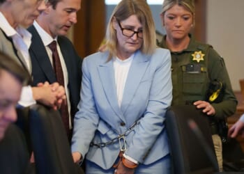 An Iowa woman pleads not guilty in the 2011 killing of real estate agent