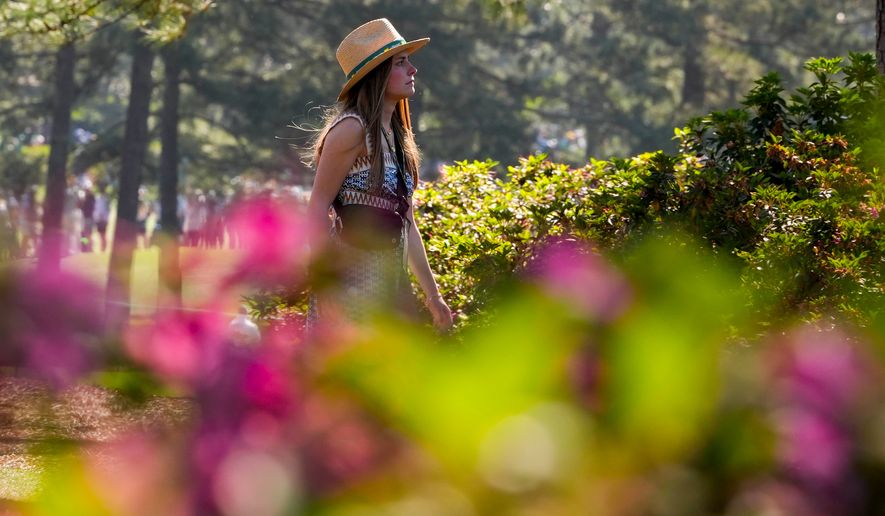 A patron walks on the 17th hole during the second round of the Masters golf tournament at the Augusta National Golf Club, Friday, April 10, 2026, in Augusta, Ga. (AP Photo/Matt Slocum)