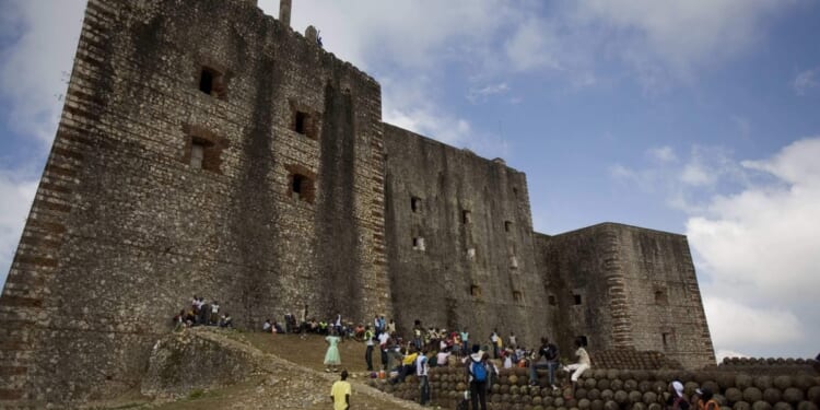 A stampede at a Haitian mountaintop fortress kills at least 25 people and injures dozens