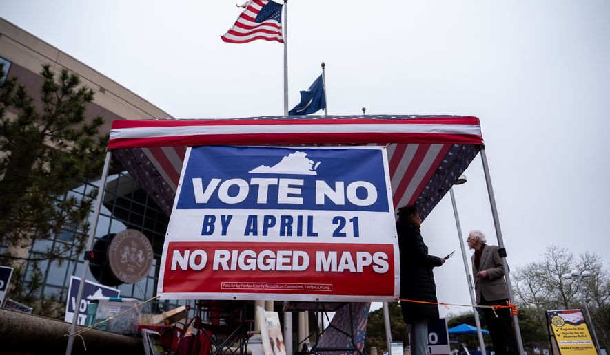 Fairfax County Republican Committee members Harry Lowcock and Esmat Mostafaeithe wait to talk voters outside the Fairfax County Government Center during early voting for the Virginia redistricting referendum Friday, April 3, 2026, in Fairfax, Va. (AP Photo/Julia Demaree Nikhinson)