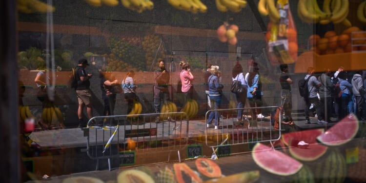 Migrants rush to apply under Spain’s new mass legalization program