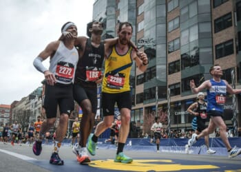 Runners were struggling to finish Boston Marathon when competitors came along and helped them across