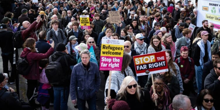 Stand Up To Racism protesters gather in outside on March 28, 2026.