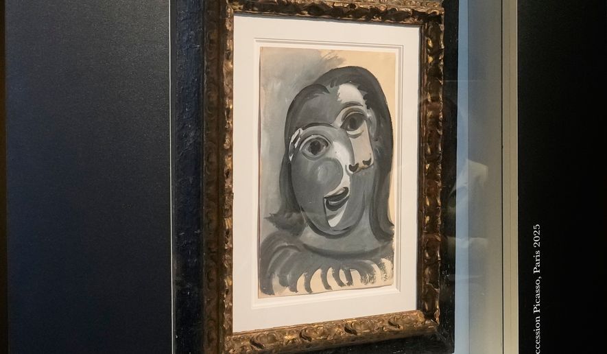 The Head of a Woman by Pablo Picasso, painted in 1941, is presented in Paris, Friday, April 10, 2026, where the draw will be handled by auction house Christie's next week. (AP Photo/Michel Euler)