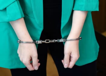 The woman allegedly leaked information between 2022 and 2025, investigators claimed.