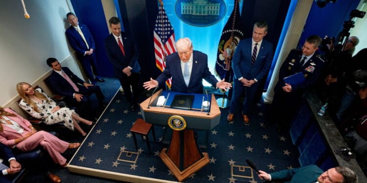 President Donald Trump speaks and gestures in the James S. Brady Press Briefing Room of the White House on April 6, 2026 in Washington, DC.