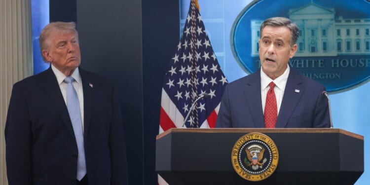 CIA Director John L. Ratcliffe speaks as President Donald Trump looks on during a news conference Monday at the White House in Washington, D.C. Ratcliffe and Trump spoke about the successful military mission to rescue a weapons systems officer whose F-15E Strike Eagle was shot down Friday in Iran.