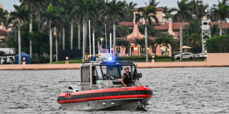 Members of the U.S. Coast Guard patrol the access point near President Donald Trump's Mar-a-Lago resort during the "No Kings" national day of protest, in Palm Beach, Florida, on May 28, 2026.