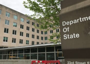 A sign for the Department of State stands outside a US diplomacy building in Washington, DC on April 19, 2019.