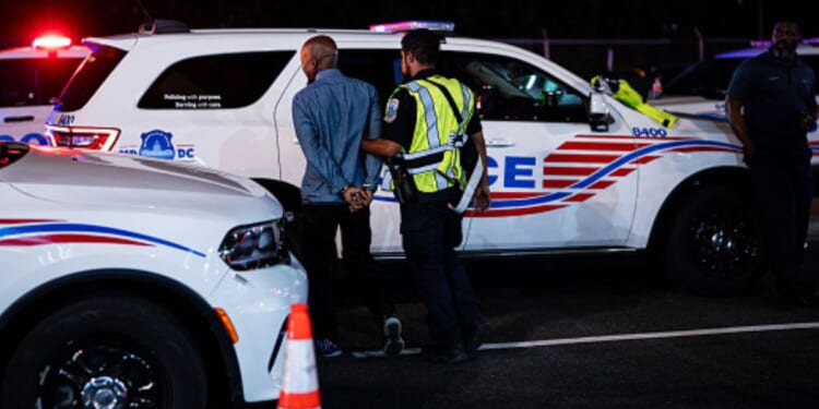 Individual gets arrested by Metropolitan Police in Washington, D.C. on August 28, 2025.
