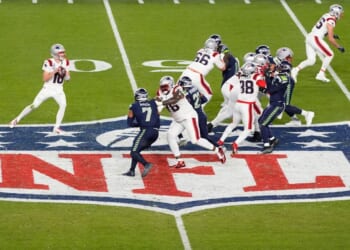 Drake Maye #10 of the New England Patriots drops back to pass against the Seattle Seahawks during the fourth quarter in Super Bowl LX Feb. 8 in Santa Clara, California.