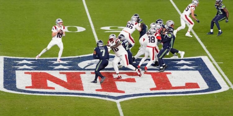 Drake Maye #10 of the New England Patriots drops back to pass against the Seattle Seahawks during the fourth quarter in Super Bowl LX Feb. 8 in Santa Clara, California.