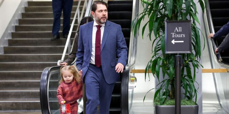 Sen. Ruben Gallego walks through the Senate subway with his daughter Isla during a vote on March 4, 2026, in Washington, D.C.