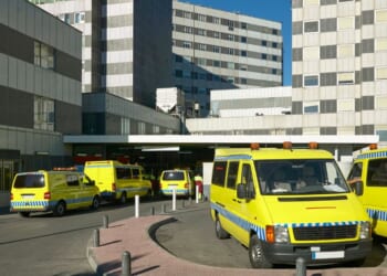 An ambulance in a hospital parking lot in Spain.
