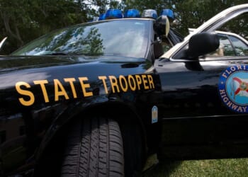 A Florida state trooper vehicle sits in the daylight.
