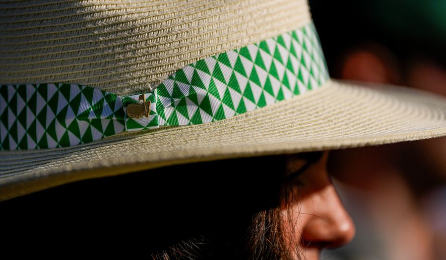 A patron watches during the second round of the Masters golf tournament at the Augusta National Golf Club, Friday, April 10, 2026, in Augusta, Ga. (AP Photo/Ashley Landis)
