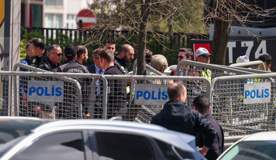 Turkish police secure the area after a gunmen attack at a building housing the Israeli Consulate in Istanbul, Turkey, Tuesday, April 7, 2026. (Omer Hamza Yildiz/DIA Photo via AP)