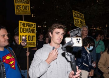 Conservative influencer Nick Shirley films protestors demonstrating against U.S. Immigration and Customs Enforcement arrests on Oct. 22, 2025, in New York City.