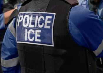 An Immigration and Customs Enforcement officer is seen in a stock photo. The FBI is participating in the investigation of a shooting Tuesday by ICE agents who said a California gang member attempted to run down an officer.