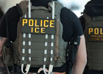 Immigration and Customs Enforcement agents walk through Terminal C at LaGuardia Airport in New York on March 24, 2026.