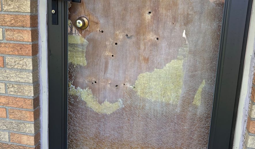 This photo provided by Sara Hindi, chief communications officer for the Indianapolis City-County Council shows damage at the front door of Councilman Ron Gibson's Indianapolis home on Monday, April 6, 2026. (Communications office for the Indianapolis City-County Council via AP)