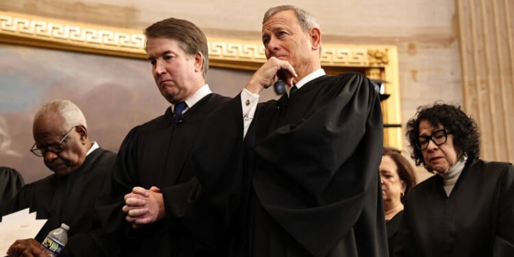 Supreme Court Justices Clarence Thomas and Brett Kavanaugh, Chief Justice John Roberts, and Supreme Court Justice Sonia Sotomayor bow their heads during inauguration ceremonies in the Rotunda of the U.S. Capitol on Jan. 20, 2025, in Washington, D.C.