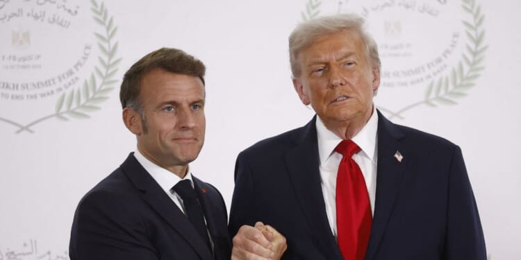 French President Emmanuel Macron and President Donald Trump shake hands during the greetings ceremony at the Gaza Peace Summit in Sharm El-Sheikh, on Oct. 13, 2025.