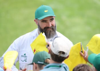 Jason Kelce signs his autograph for patrons near the ninth hole during the Par Three Contest prior to the 2026 Masters Tournament at Augusta National Golf Club on April 8, 2026, in Augusta, Georgia.