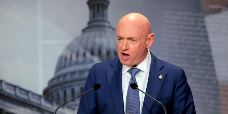 Sen. Mark Kelly speaks on the failed grand jury indictment against him during a news conference at the U.S. Capitol on Feb. 11, 2026, in Washington, D.C.