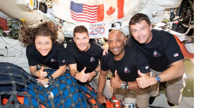 The Artemis II crew – from left, Mission Specialist Christina Koch, Mission Specialist Jeremy Hansen, Pilot Victor Glover, and Commander Reid Wiseman – pause for a group photo inside the Orion spacecraft on their way home. They are headed back to Earth for a splashdown in the Pacific Ocean Friday.
