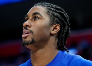 Jaden Ivey, playing for the Detroit Pistons, looks on at Little Caesars Arena in Detroit, Michigan, prior to a match against the Milwaukee Bucks on Dec. 6, 2025.