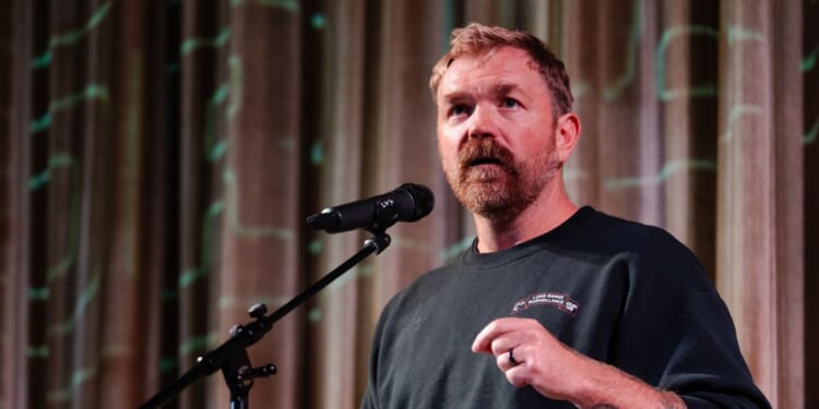 Graham Platner speaks at a town hall at the Leavitt Theater on Oct. 22, 2025, in Ogunquit, Maine.
