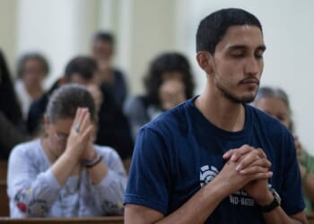 Nicaraguans attend a mass during celebrations in a church in San Jose, Costa Rica, on Dec. 7, 2023.