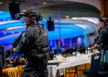 Armed secret service agents flood the stage of the White House Correspondents’ Dinner on April 25, 2026.