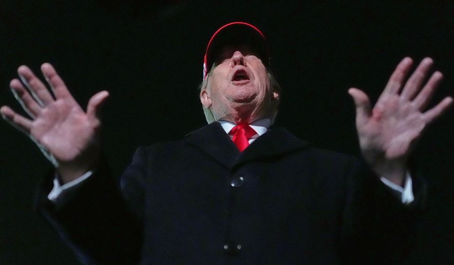 President Donald Trump speaks with reporters at Joint Base Andrews, Md., Sunday, April 12, 2026, after he returned from Miami. (AP Photo/Julia Demaree Nikhinson)