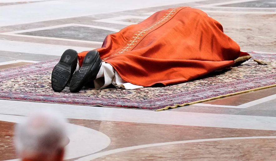 Pope Leo XIV attends the Celebration of the Passion of the Lord in St. Peter's Basilica at the Vatican on Catholic Good Friday, Friday, April 3, 2026 (AP Photo/Andrew Medichini)