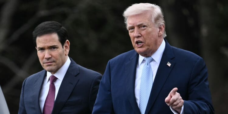 President Donald Trump walks with Secretary of State Marco Rubio as he departs from the South Lawn of the White House in Washington, D.C., on March 20, 2026, for his Mar-a-Lago residence, where he will spend the weekend.