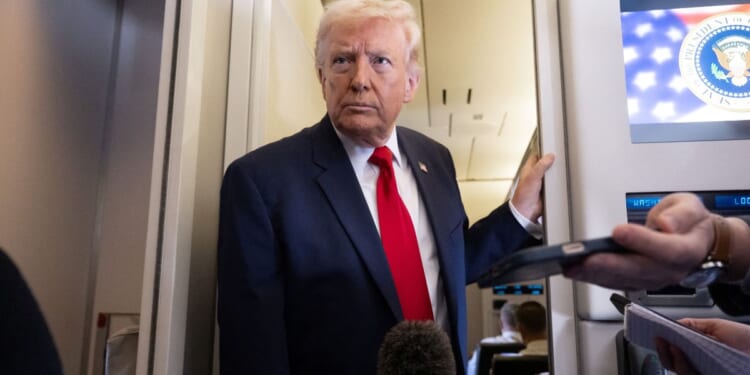 President Donald Trump speaks with the media aboard Air Force One during a flight from Dover, Delaware, to Miami, Florida, on March 7, 2026.