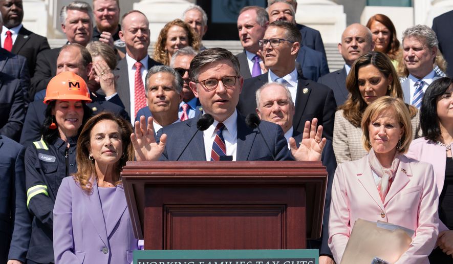 Speaker of the House Mike Johnson, R-La., and fellow Republicans celebrate GOP tax policies at an event outside the Capitol in Washington, Wednesday, April 15, 2026. (AP Photo/J. Scott Applewhite)